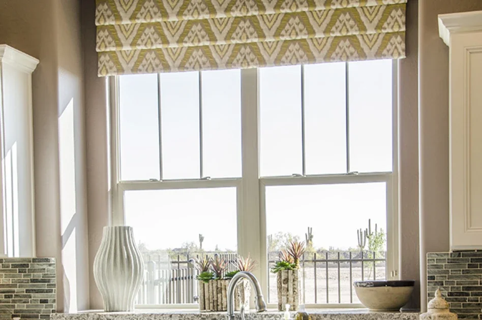 two MI windows above a kitchen sink. These hung windows feature a 3 panel simulated divided lite grid pattern.